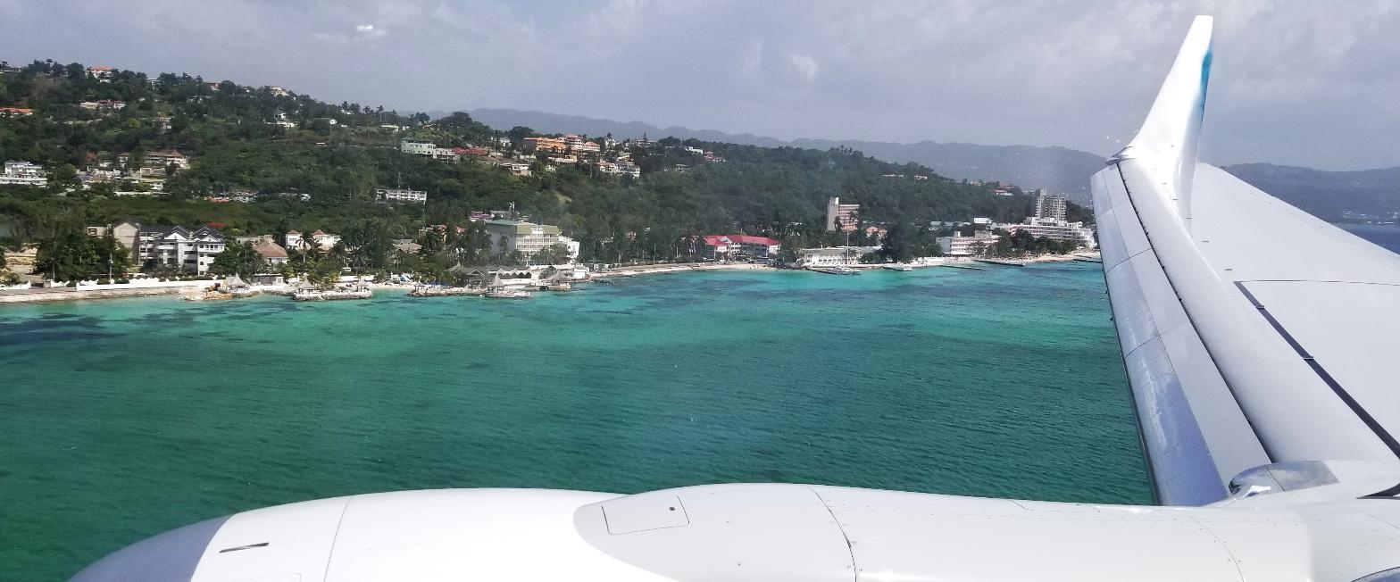 The Montego Bay coastline and hotels seen from a plane window on the approach into Sangster airport
