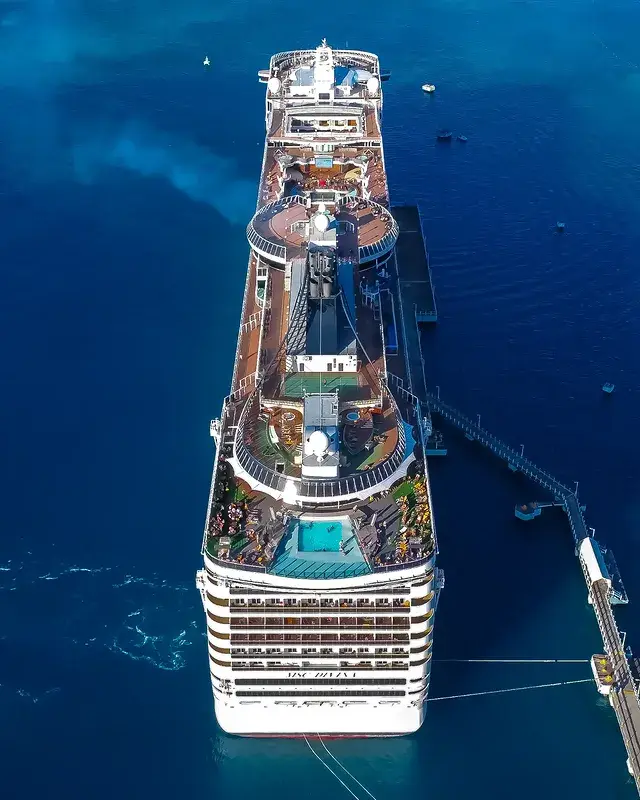 A cruise ship tied up alongside the pier in Jamaica, seen from above